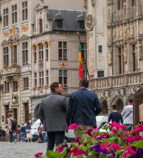 Friends walking through European city