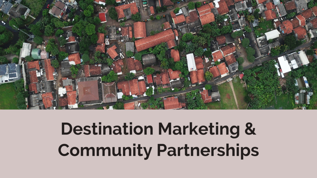 an aerial view of a neighborhood with greenery around, the bottom of the image displays the title of the blog: Destination Marketing & Community Partnerships