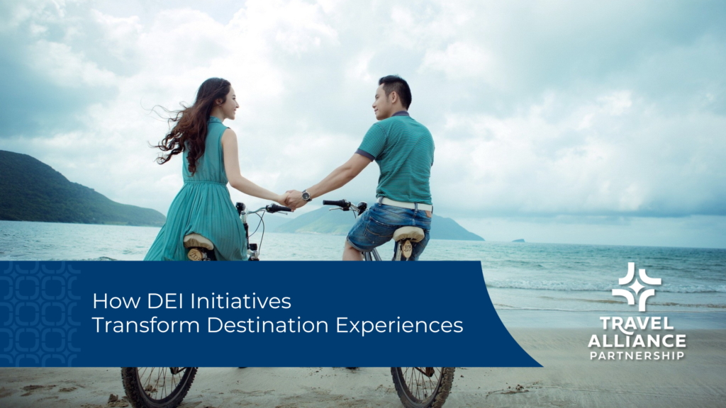 a landscape of mountains and ocean with a beach in the foreground. Two people on bicycles hold hands, a woman on the left wears a teal dress and a man on the left wears a teal shirt with jeans. A blue title overlay with white text reads "How DEI Initiatives Transform Destination Experiences" with the Travel Alliance Partnership logo