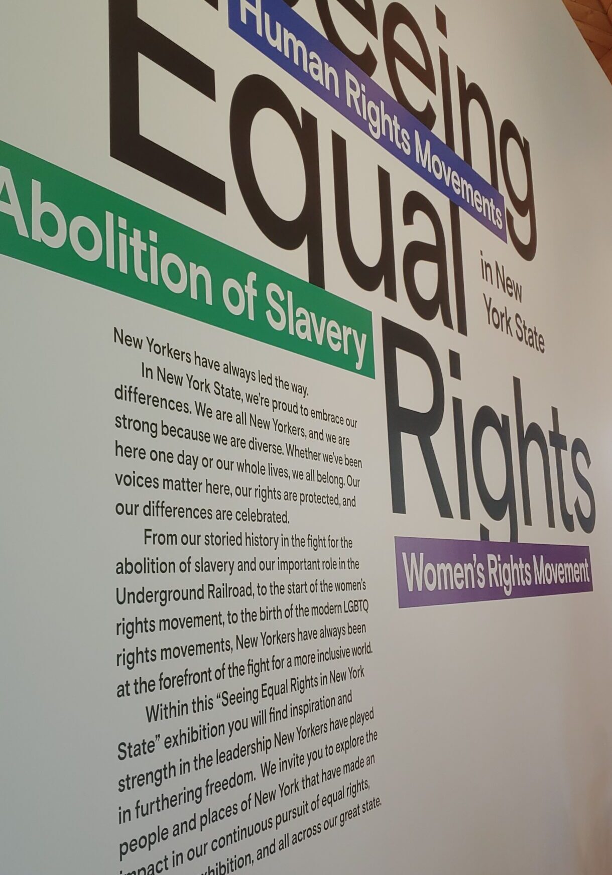white wall at an angle with large words reading Seeing Equal Rights with smaller text below
